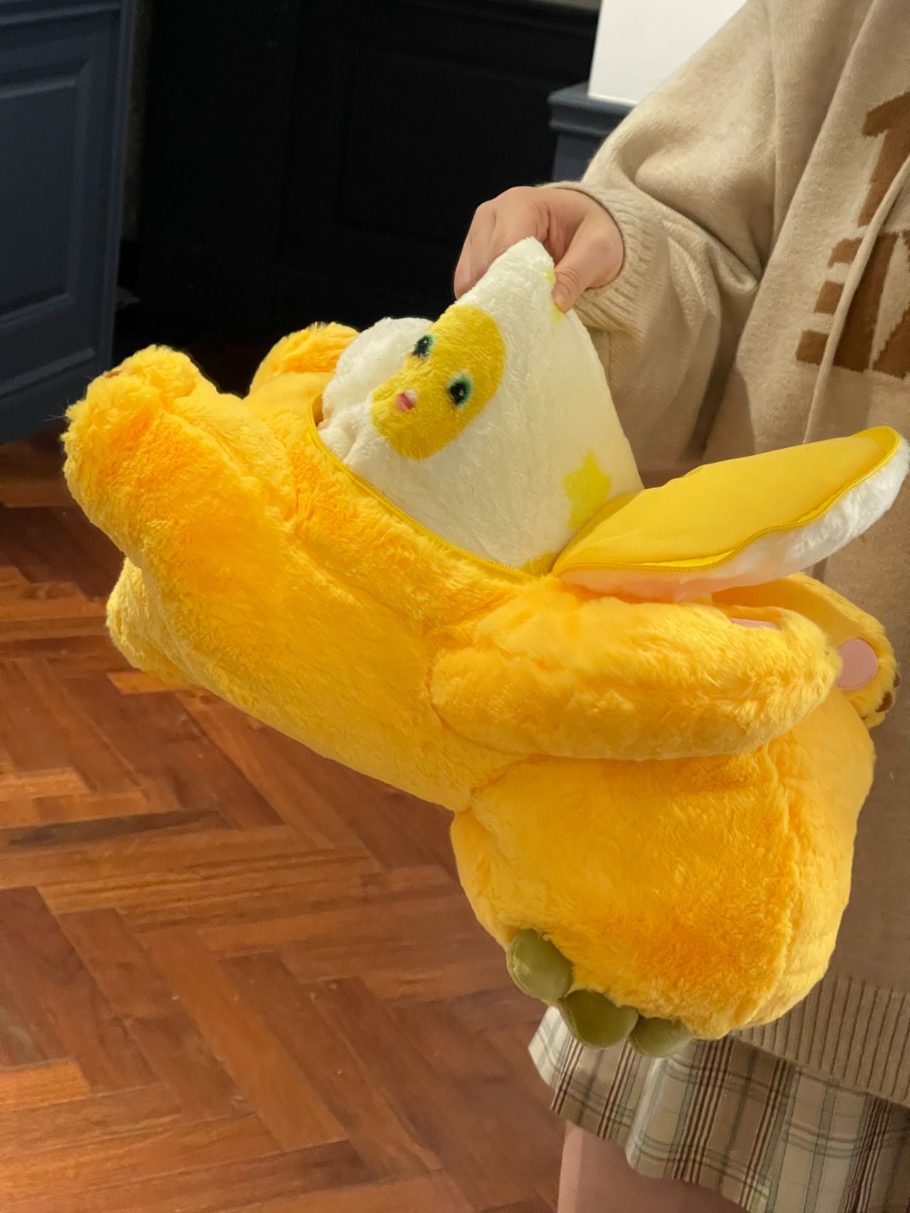 Yellow dinosaur doll with blanket ๐